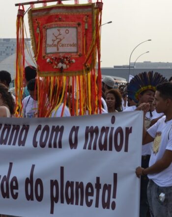 Group marching with banner