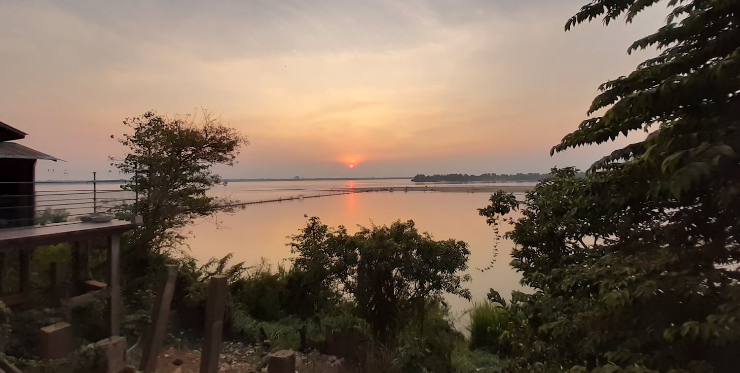 Sunset over calm river.