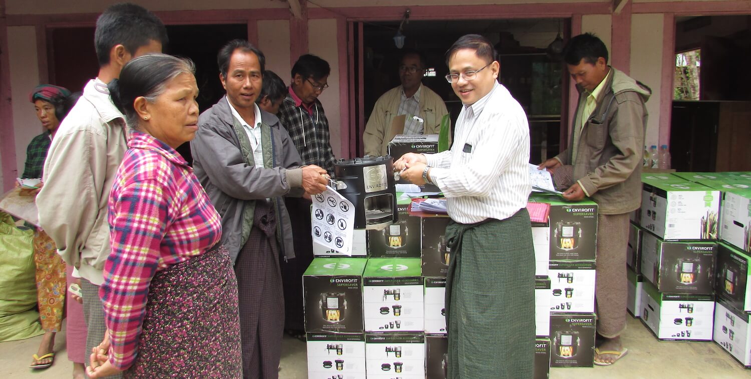 Handing out boxes containing energy-efficient stoves.