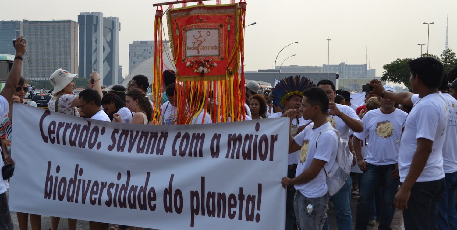 Group marching with banner