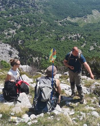 Four people on mountain.
