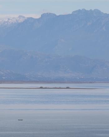 Lake, mountains in background.