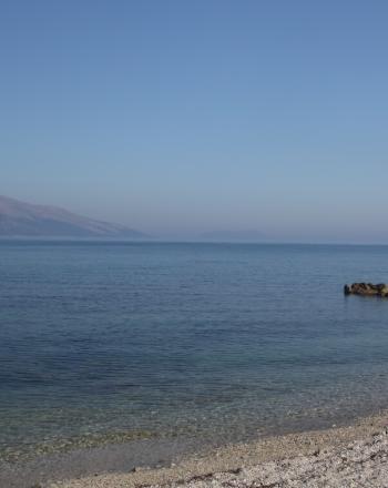 Shoreline with mountains in the distance.