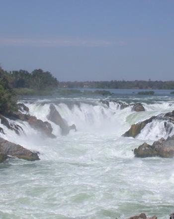 Group of short waterfalls in a horseshow shape.