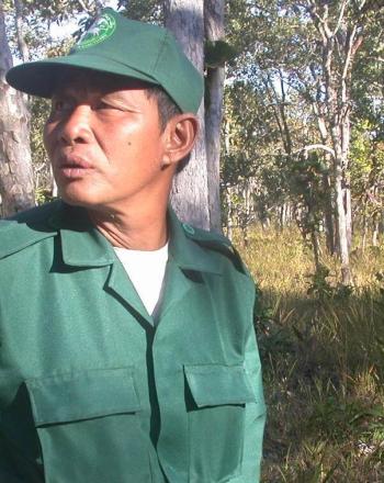 Ranger in green looking over shoulder.