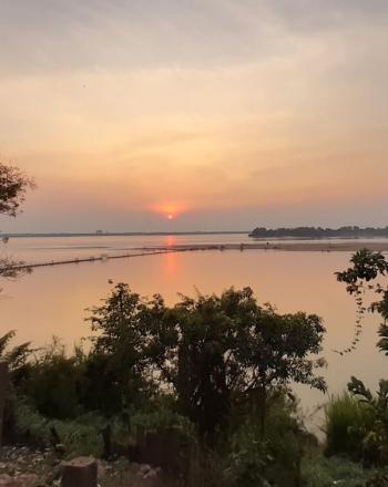 Sunset over calm river.