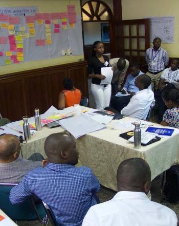 Group of people in meeting.