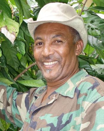 Man showing plant