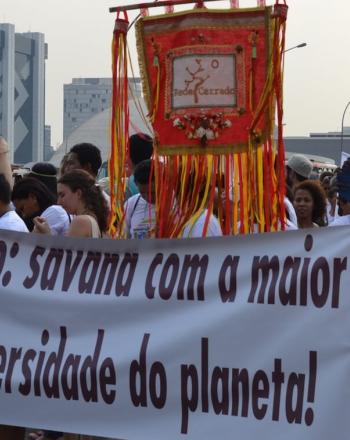 Group marching with banner