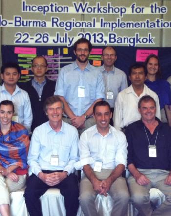 Group of 17 people standing/sitting for photo.